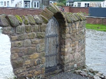 Old gateway in stone wall.