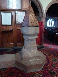 The font in Bromfield Church.