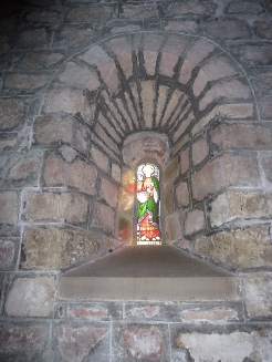 A tiny stained glass window in Kirkbampton.