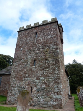 The crenalated tower of Newton Arlosh Church. 